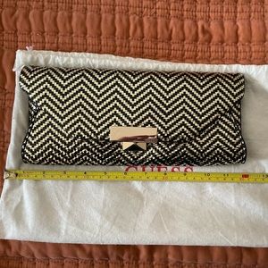 Black and gold Guess clutch